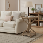 Beige sofa with decorative pillows and a wooden side table in a living room setting.