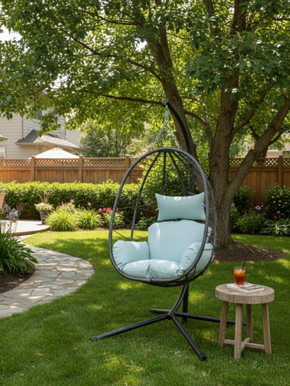 Rattan egg-shaped basket with light blue cushions