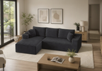 Modern living room with a dark blue sectional sofa, wooden coffee table, and decorative elements.