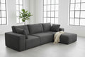 Gray sectional sofa in a living room setting with decor elements.
