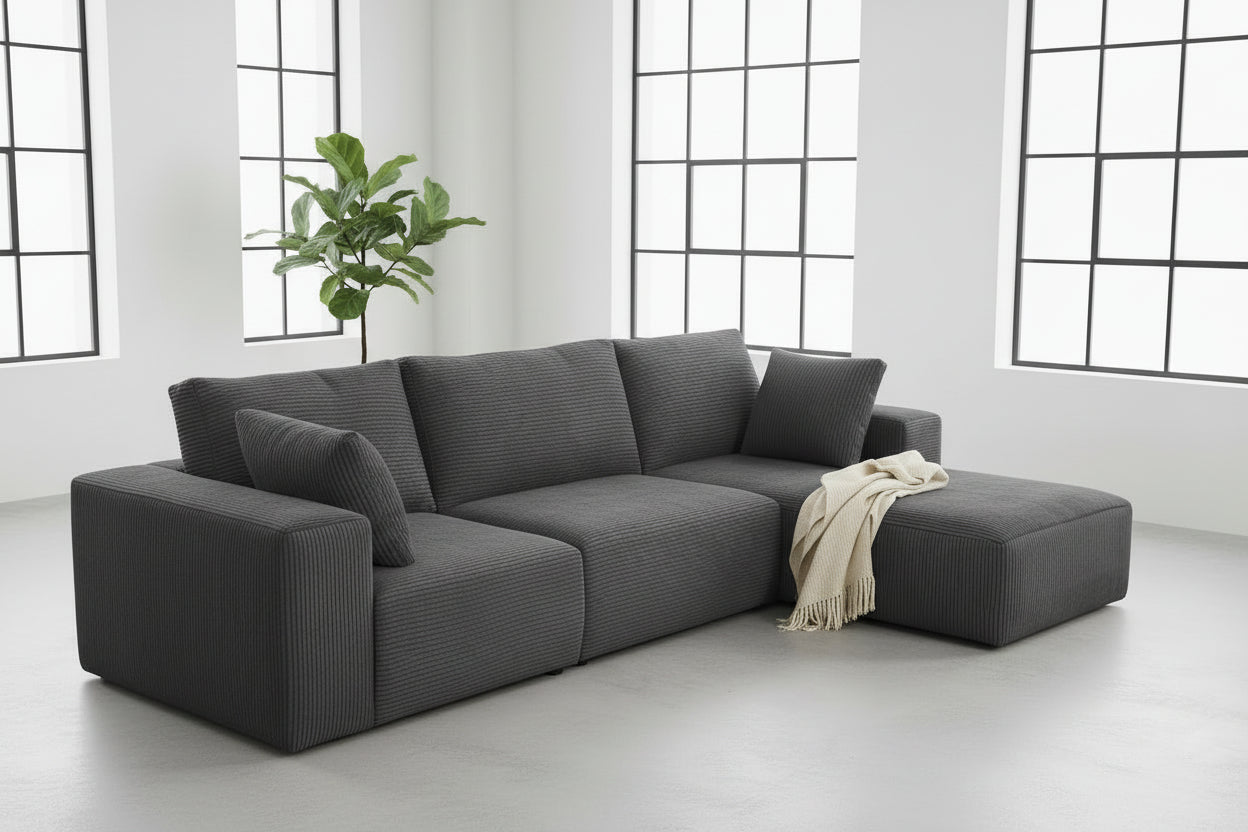Gray sectional sofa in a living room setting with decor elements.