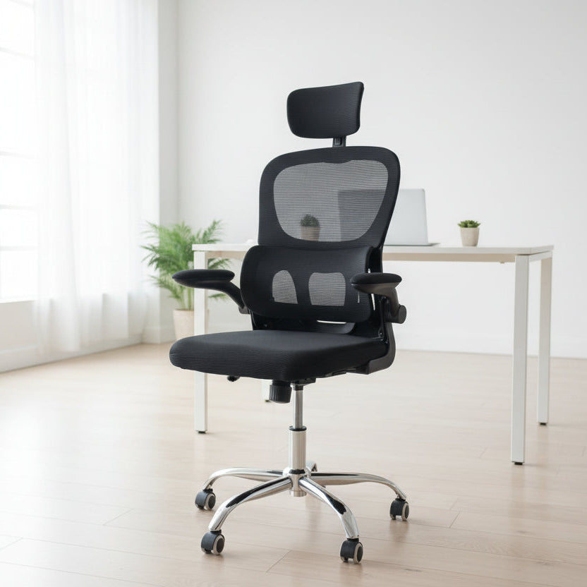 Black office chair with mesh backrest in a bright room