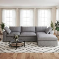 Gray sectional sofa in a living room with a coffee table and decor items.