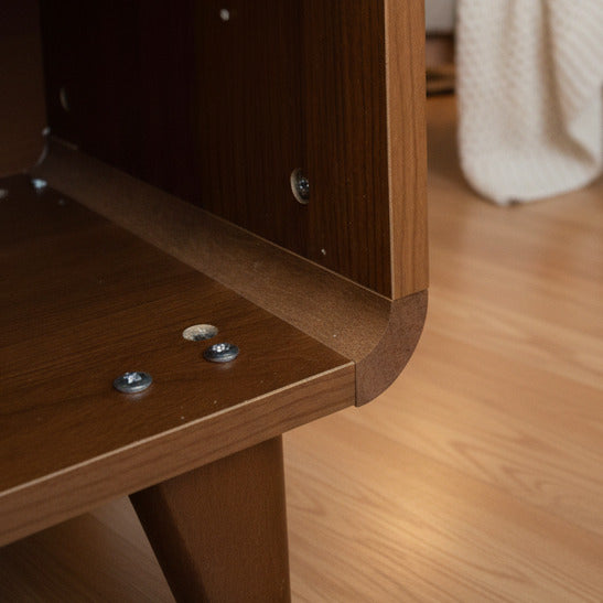 Wooden shelf with screws on a dark surface