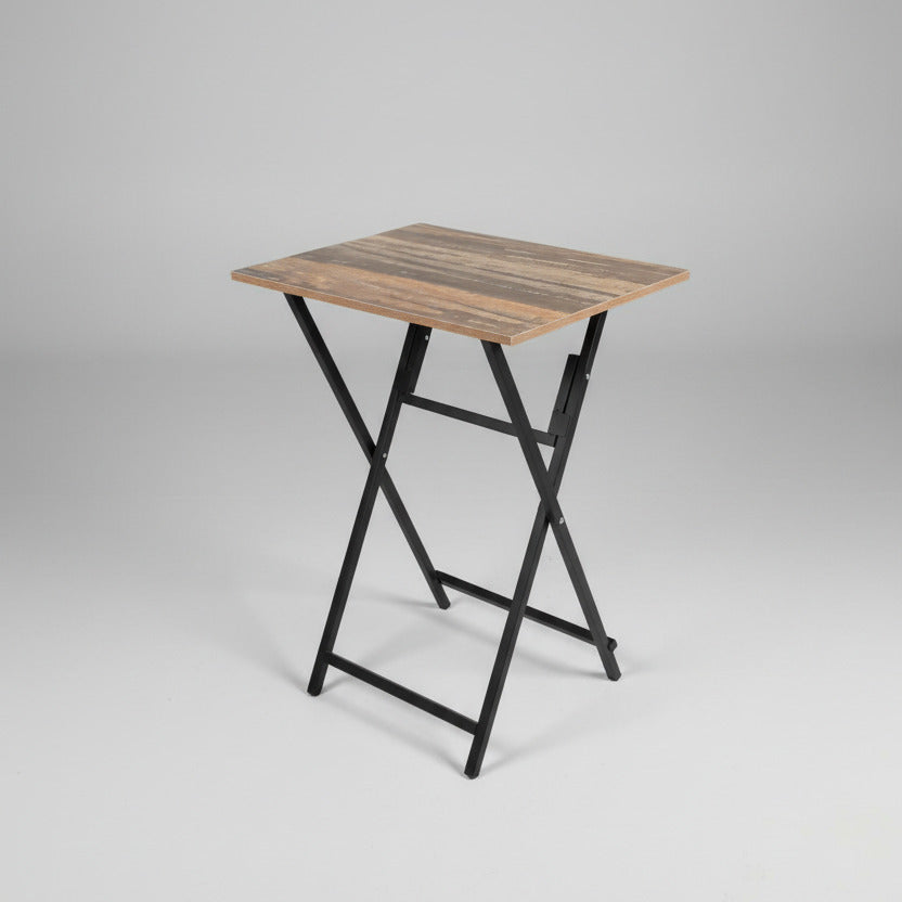 Wooden table with metal legs on a gray carpeted floor