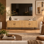 Wooden sideboard in a room with a large abstract painting on the wall.